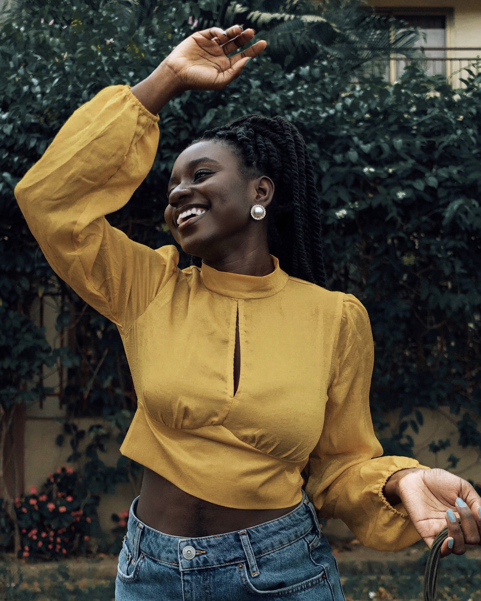top trend accessories for 2019-yellow satin mock neck tie back top-pearl earrings-cult Gaia tassel bag dupe